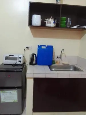 a kitchen counter with a sink and a microwave at For Rent in Cainta, Rizal: Short / Long Term Lease in Cainta