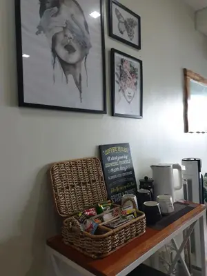 a table with a basket on top of it at Posada De Michi - Acqua Private Residences in Manila