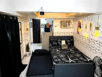 a bed in the back of a camper van at Rooftop Condo Makati in Manila