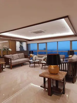 a living room with a couch and a table at Jk Coastal Inn in Manila