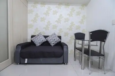 a living room with a couch and two chairs at 1BR Suite @ SM Jazz Residences - WIFI & Netflix in Manila