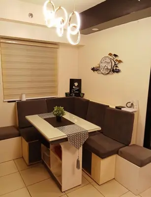 a living room with a couch and a table at Joey's Place Calathea DMCI in Manila
