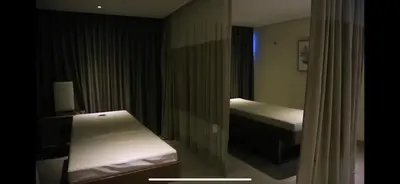 a room with a bed and a sink in it at 1 BR condo Uptown Parksuites BGC, high floor, morning sun in Manila