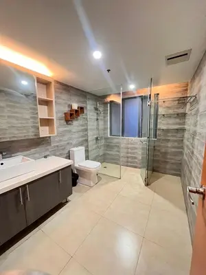 a bathroom with a toilet and a sink and a shower at 1 bedroom Service Aprtmnt 2pax allows other 4pax 25011 in Cubao Quezon City in Manila