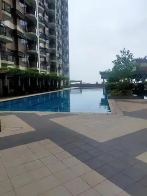 a swimming pool in the middle of a building at The Radiance Manila Bay in Manila