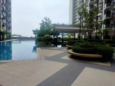 a swimming pool in the middle of a building at The Radiance Manila Bay in Manila