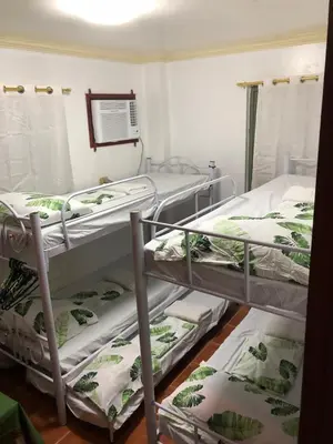 a room with two bunk beds in a room at THE MANSION- Near NAIA Airport Terminal PASAY in Manila