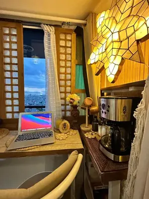 a laptop computer sitting on a counter in a kitchen at Balay Sa Air, Beyond Ordinary at Air Residences Makati in Manila