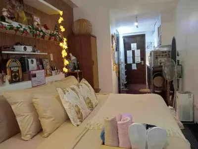 a room with a bed with shoes on it at Balay Sa Air, Beyond Ordinary at Air Residences Makati in Manila