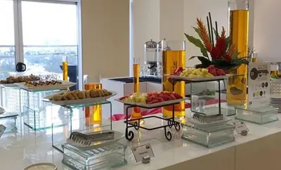 a buffet with several plates of food on a table at Privato Ortigas in Manila