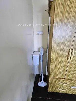 a bathroom with a toilet in a room at The Rochester - Flat in Pasig near BGC in Manila