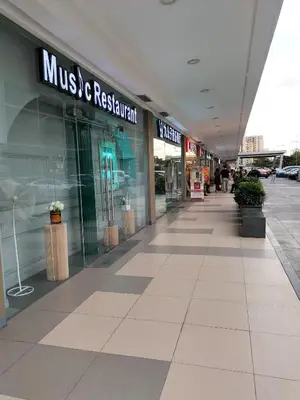 an empty mall with a music and retail store at Cozy 619 shore2 residence tower2 near MOA in Manila