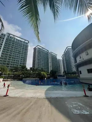 a swimming pool in a resort with tall buildings at AZURE URBAN RESORT Maldives tower in Manila