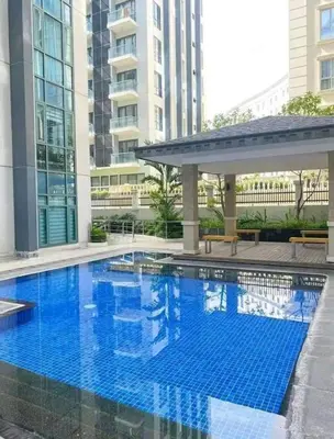a large blue swimming pool in a building at TWO PALMTREE VILLAS NEWPORT BOULEVARD NEAR NAIA 3 PASAY CITY in Manila