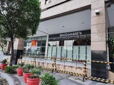 a mcdonalds store front with plants in front of it at TWO PALMTREE VILLAS NEWPORT BOULEVARD NEAR NAIA 3 PASAY CITY in Manila
