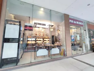 a store front window of a bakery with pastries at TWO PALMTREE VILLAS NEWPORT BOULEVARD NEAR NAIA 3 PASAY CITY in Manila