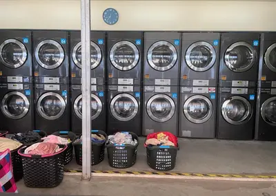 a bunch of washing machines in a laundry room at Pandora's Nest in Manila