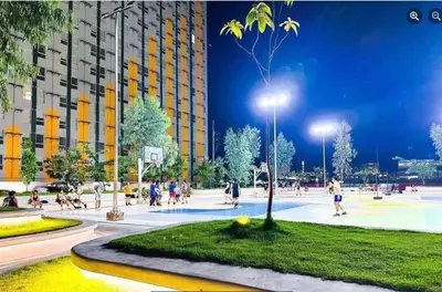 a group of people playing basketball in a park at night at Pandora's Nest in Manila