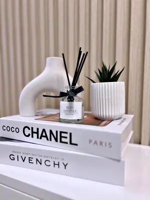 a display of a chanel display on a table at Cozypura Staycation near MOA, Airport , with free fast WIFI, Netflix and pay parking in Manila
