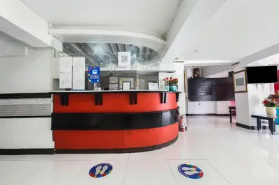 a fast food restaurant with a red and black counter at OYO 894 Cosmo Hotel P Campa Manila in Manila