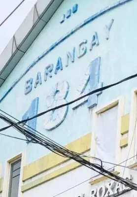 a sign on the side of a building at THE MANSION - 24-HOUR Near AirPort Hostel 4 Backpackers in Manila