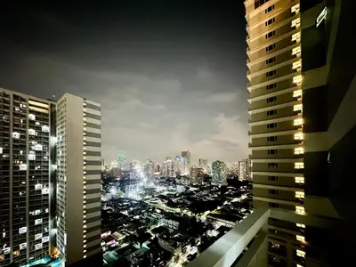 a city skyline at night with tall buildings at 1 Bedroom Condo near CCP Roxas Boulevard Pasay in Manila