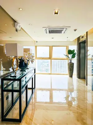 a room with a glass table and a large window at 1 Bedroom Condo near CCP Roxas Boulevard Pasay in Manila
