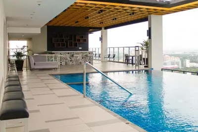 a swimming pool in the middle of a building at The Residences at BCCT in Manila