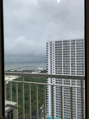 a view of a large building from a balcony at SMDC Coast Residences Roxas Boulevard corner Pasay Condo Unit in Manila