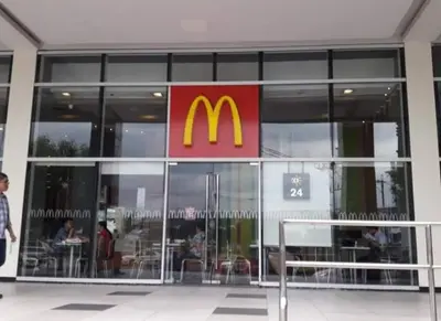 a mcdonalds restaurant with a sign on the front of it at 101 Newport Boulevard -Terminal 3 Airport in Manila