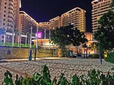 a view of a building at night at Azure Beach Resort A5 Near Mall Airport in Manila