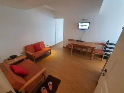 a living room with a couch and a table at Azure Beach Resort A5 Near Mall Airport in Manila