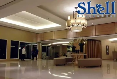 a lobby of a shilil insurance building at vin's place 1br amenities view at Shell Residence in Manila