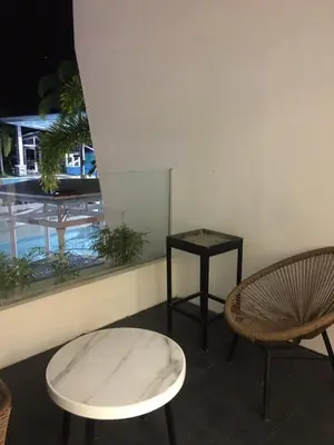 a room with two chairs and a table at SOUTHPICKRESORT & HOTEL INC. in Aplaya