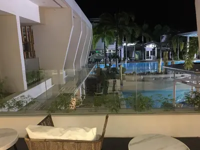 a view of the pool from the balcony of a hotel at SOUTHPICKRESORT & HOTEL INC. in Aplaya
