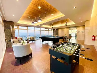 a living room with a pool table and a billiards at SMDC Coast Residences near PICC in Manila