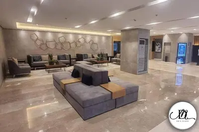 a large living room with a couch and tables at DM's Place at S Residences MOA in Manila