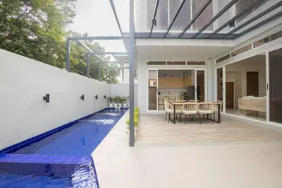 a swimming pool in the middle of a house at Addie's Place Camella Homes 2D Muntinlupa in Manila
