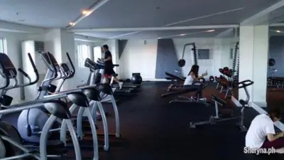 a gym with people exercising on treadmills and machines at Amazing Condo at SMDC Light Residences Boni Avenue Mandaluyong in Manila