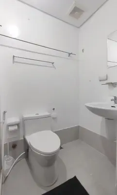 a white bathroom with a toilet and a sink at Amazing Condo at SMDC Light Residences Boni Avenue Mandaluyong in Manila
