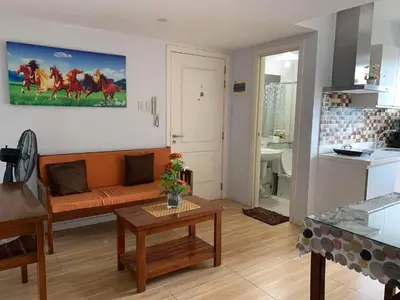 a living room with a couch and a table at Azure Urban Resort Residence A3 in Manila