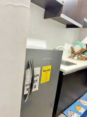 a refrigerator in a kitchen with yellow tags on it at 2BR w Balcony in Araneta, Cubao w Pool and Gym - Porto Vita in Manila