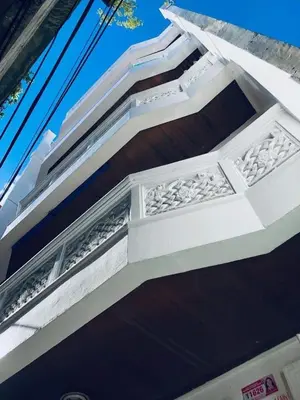 a white building with a white balcony at THE MANSION - NEAR AIRPORT BIG FAMILY Lodge in Manila