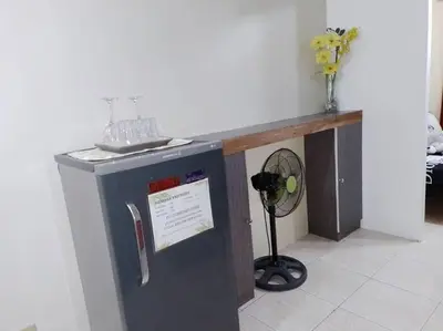 a counter in a room with a fan at Affordable Transient along Ortigas Ext in Cainta