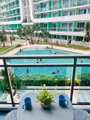a view of a swimming pool from the balcony of a building at Azure Pool View w/ Netflix & Wifi Boracay Tower in Manila