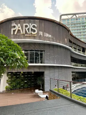 a large building with a sign that reads parks black ops at Azure Pool View w/ Netflix & Wifi Boracay Tower in Manila