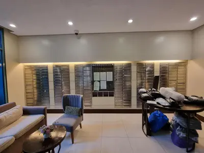 a living room with a couch and a table at Palm Tree Villas Condominium by Beth in Manila