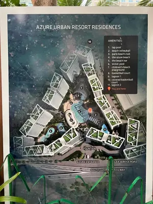 a poster of an urban resort with a map at Azure Pool View with Balcony, WiFi and Netflix in Manila