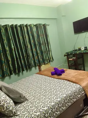 a bed with a purple bow on top of it at Pet Friendly Condo for Rent along Ortigas Ext near Cainta/ Pasig in Cainta