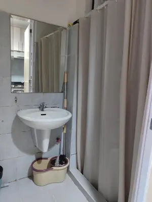 a bathroom with a sink and a shower curtain at 5 Years Legit Staycation Infront Of Moa, Sea Residences Tower A, Near Smx, Arena, Dfa, World Trade, PICC, AYALA MALL, NAIA in Manila